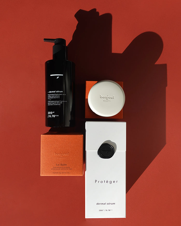 Bonjout Beauty's Le Balm product with various Proteger products on a red background