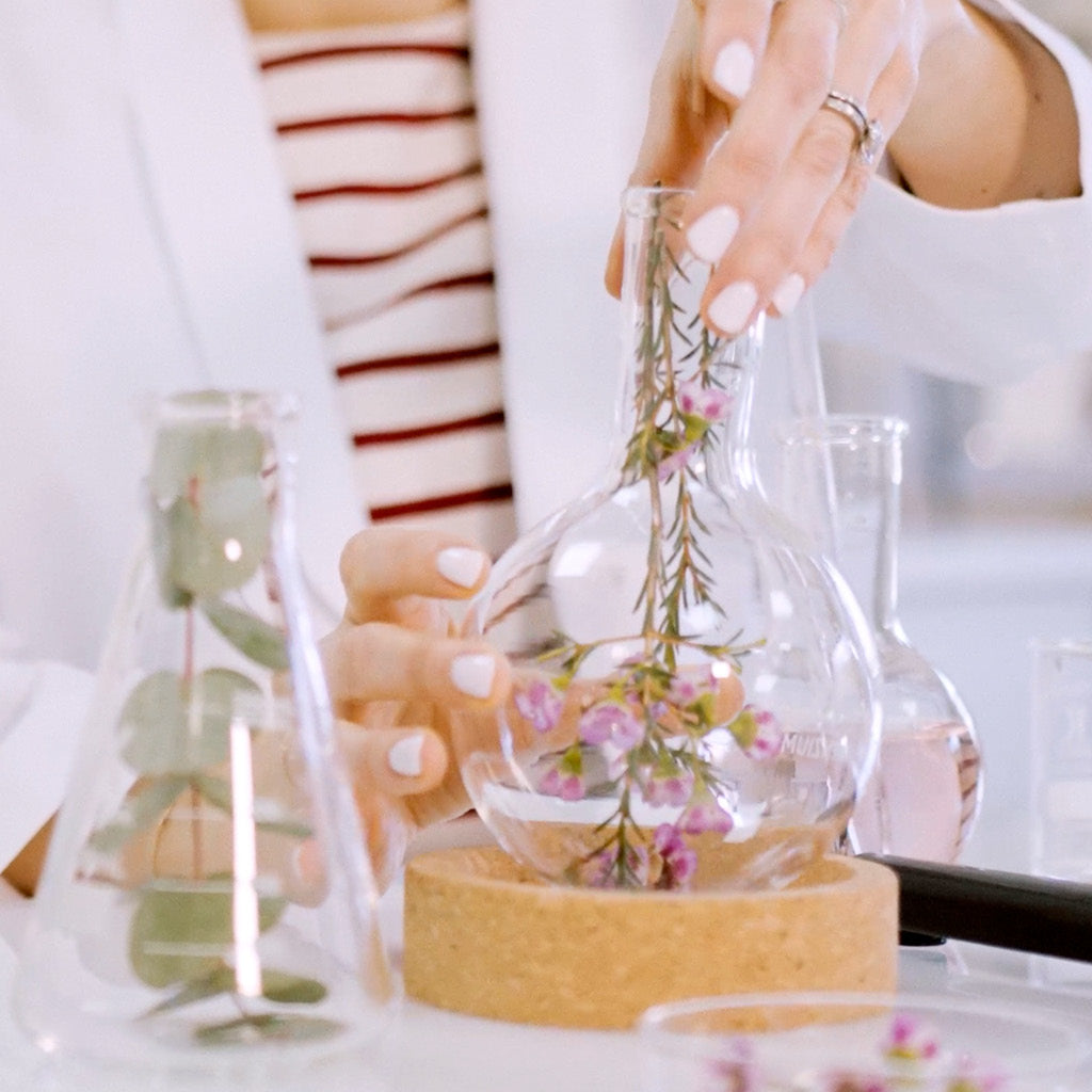 Dr. Natacha Bonjout formulating radiant skincare with plans in laboratory 