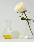 Le Balm Product with white rose and beaker
