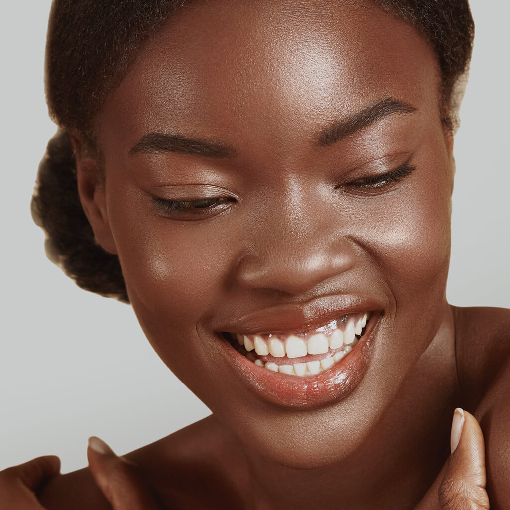Woman with radiant skin smiling